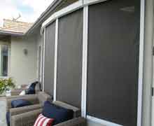 Sun Shades on a back patio with Wicker Furniture