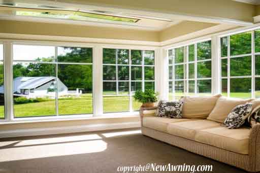 neutral color sunroom with rattan furniture