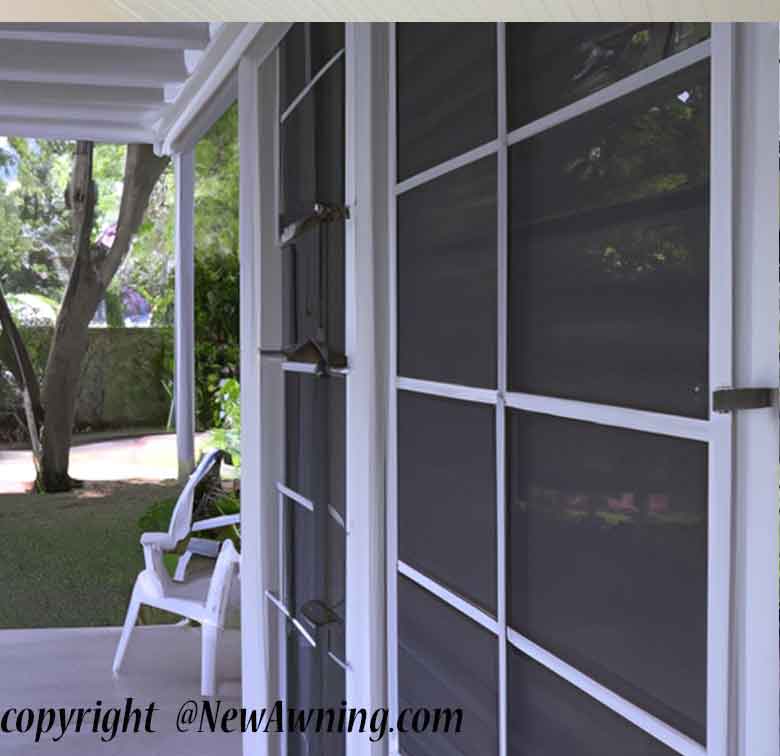 solar shades on outside of home with deck and aluminum awning overhead
