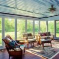 DIY screened in porch with furniture from Goodwill